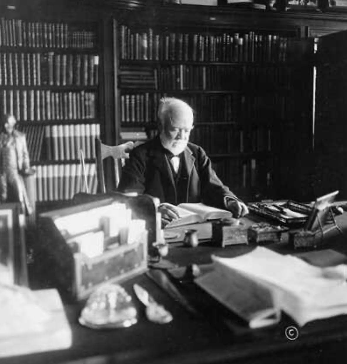 Andrew Carnegie seated at his desk — the industrialist whose 1903 grant funded the original St. Joseph Public Library